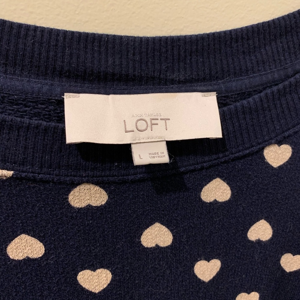 Adorable navy sweater with heart pattern